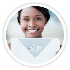 girl holding a weight scale